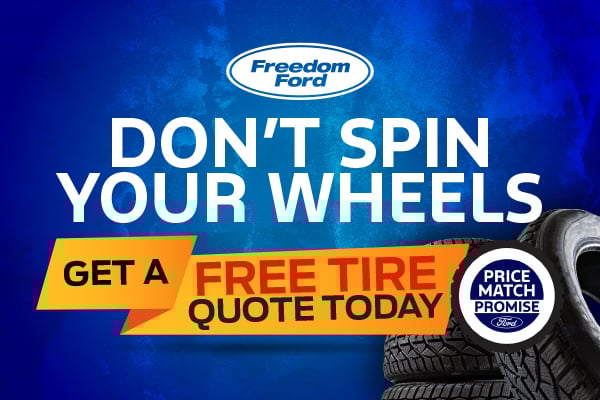 Freedom Ford promotional graphic with bold text 'Don't Spin Your Wheels' and 'Get a Free Tire Quote Today' alongside stacked tires and Ford’s Price Match Promise logo on a blue background.